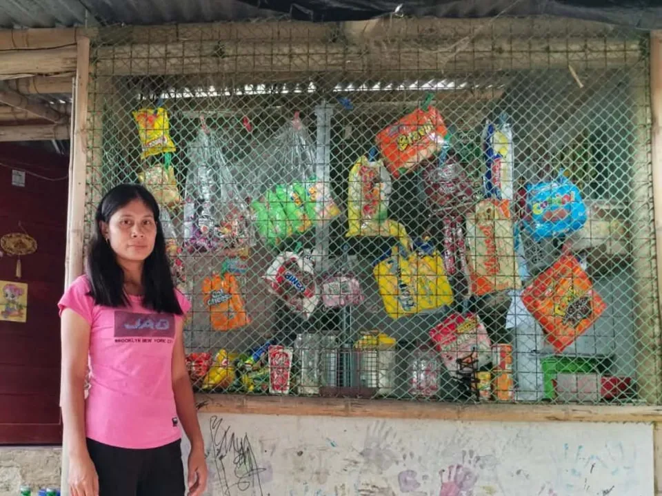 Ailyn standing in front of her sari-sari store in Barotac Viejo, Philippines
